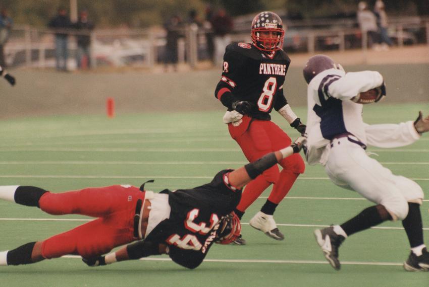 Allred attempts a diving tackle as a linebacker for the Hillcrest Panthers.
